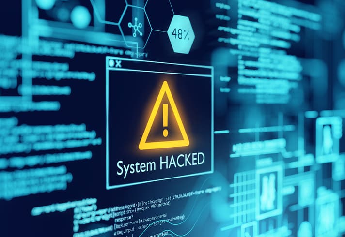 Computer screen with system hacked message where cybersecurity best practices could avoid the hack