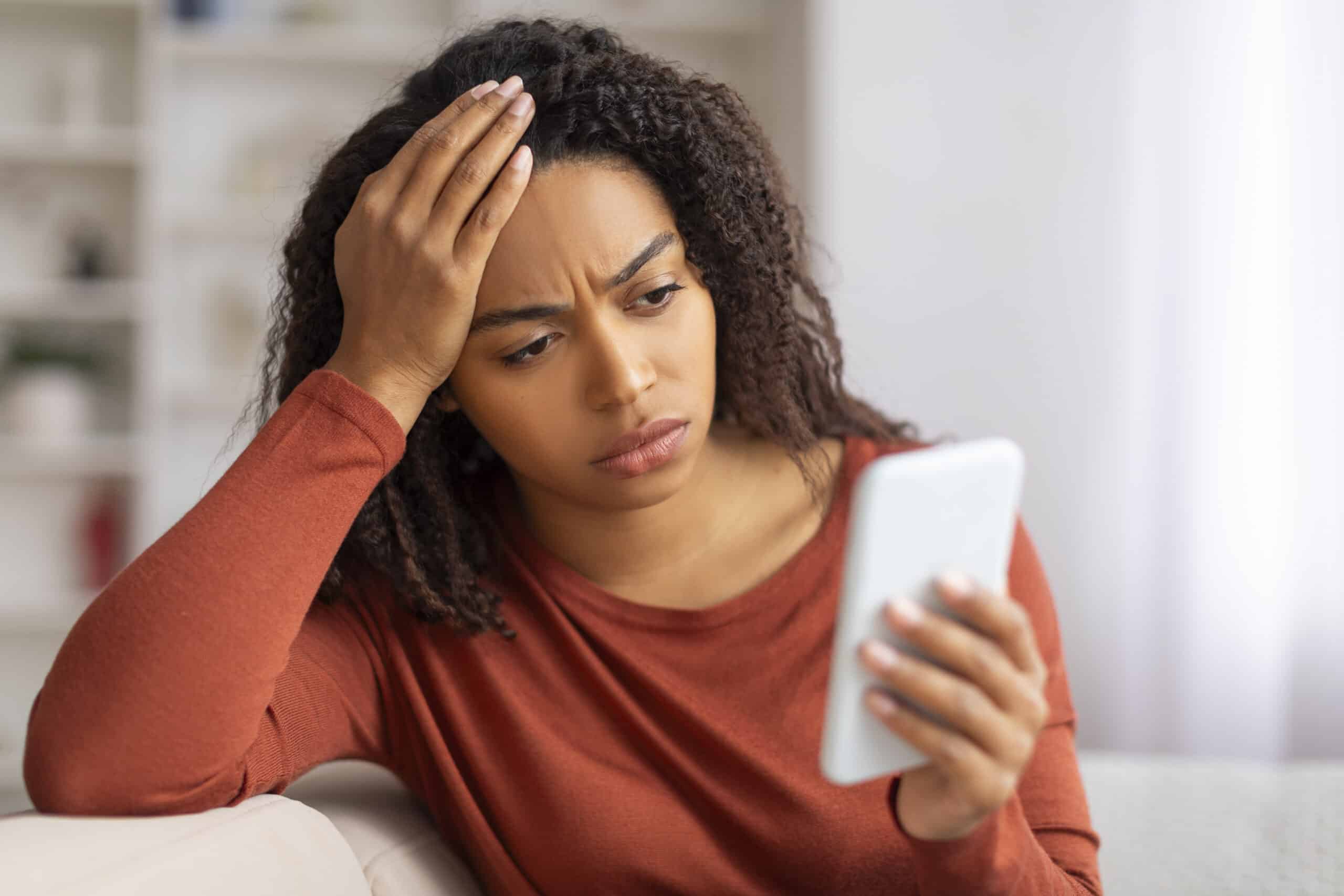 woman looking at phone