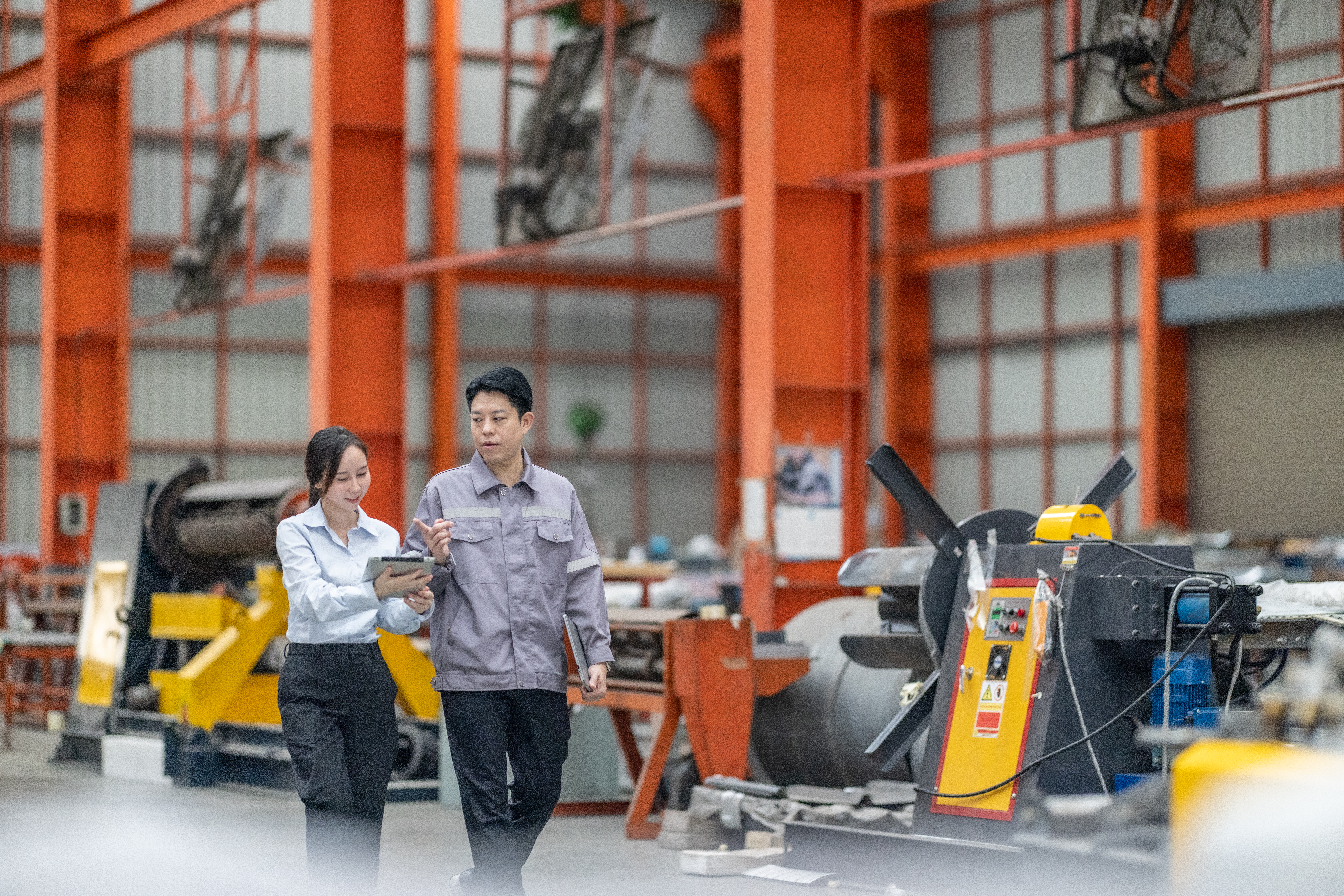 Executives walking around a manufacturing firm